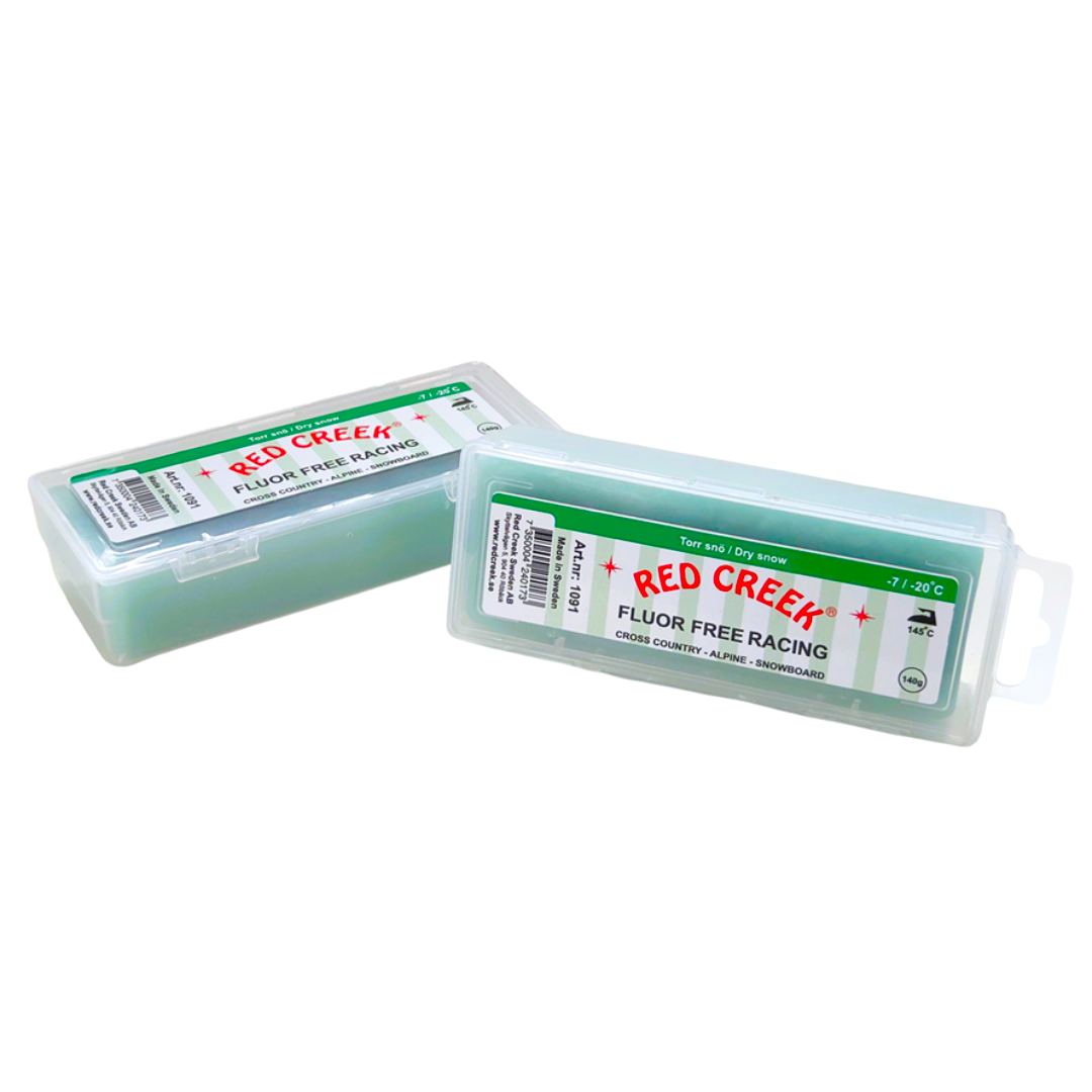 A product picture of the Red Creek Fluor-Free Racing Green Dry Snow Hard Melt Glide Wax (-7C/-20C) | 140g