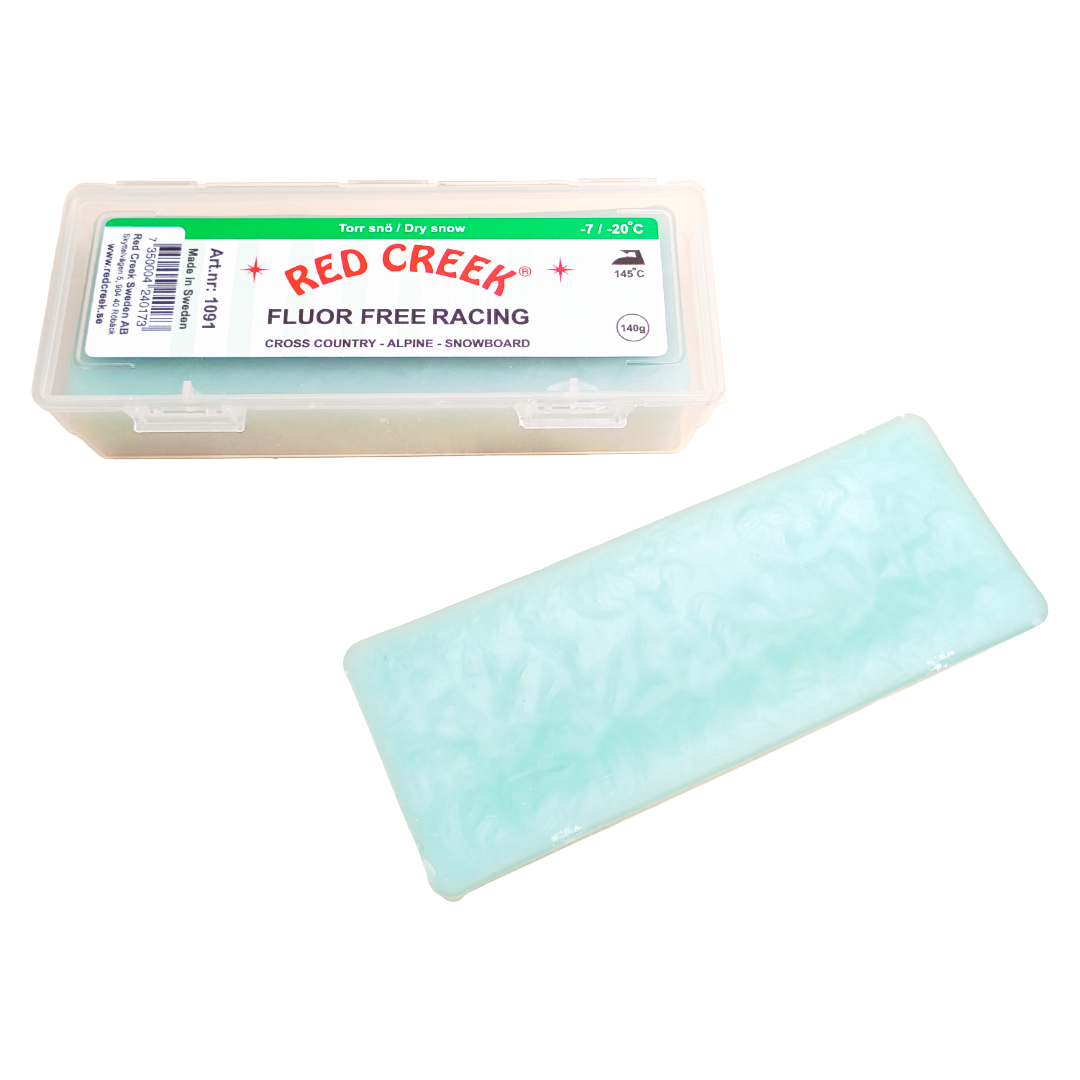 A product picture of the Red Creek Fluor-Free Racing Green Dry Snow Hard Melt Glide Wax (-7C/-20C) | 140g