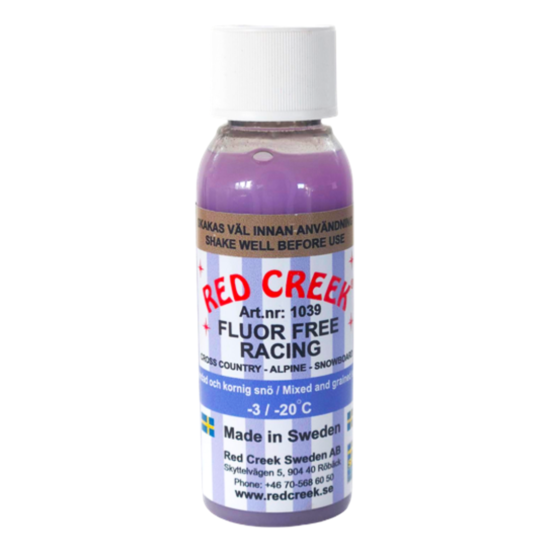 A product picture of the Red Creek Fluoro-Free Racing Indigo Mixed and Grained Snow Liquid Glide Wax (-3C/-20C) | 90ml
