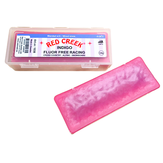 A product picture of the Red Creek Fluoro-Free Indigo Mixed Snow Hard Melt Glide Wax (-3C/-20C) | 140g