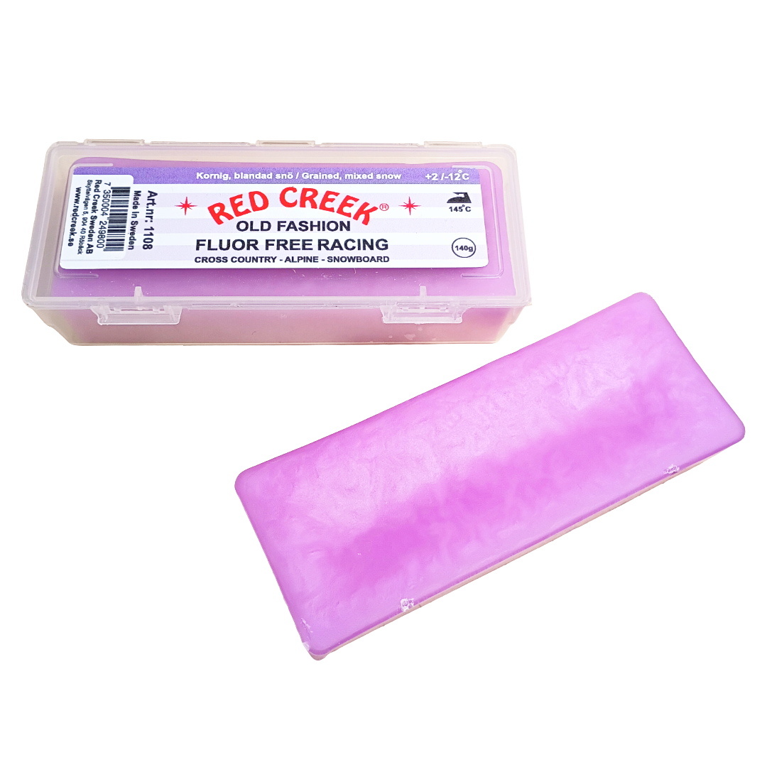A product picture of the Red Creek Fluor-Free Violet 'Old Fashion' Grained, Mixed Snow Melt Glide Wax (2C/-12C) | 140g