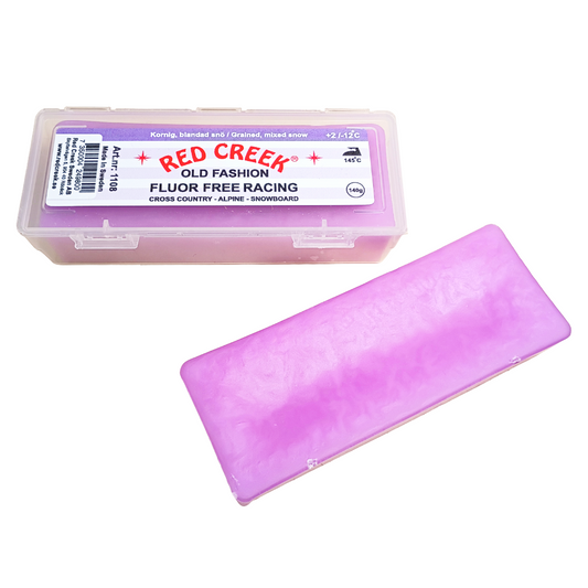 A product picture of the Red Creek Fluor-Free Violet 'Old Fashion' Grained, Mixed Snow Melt Glide Wax (2C/-12C) | 140g